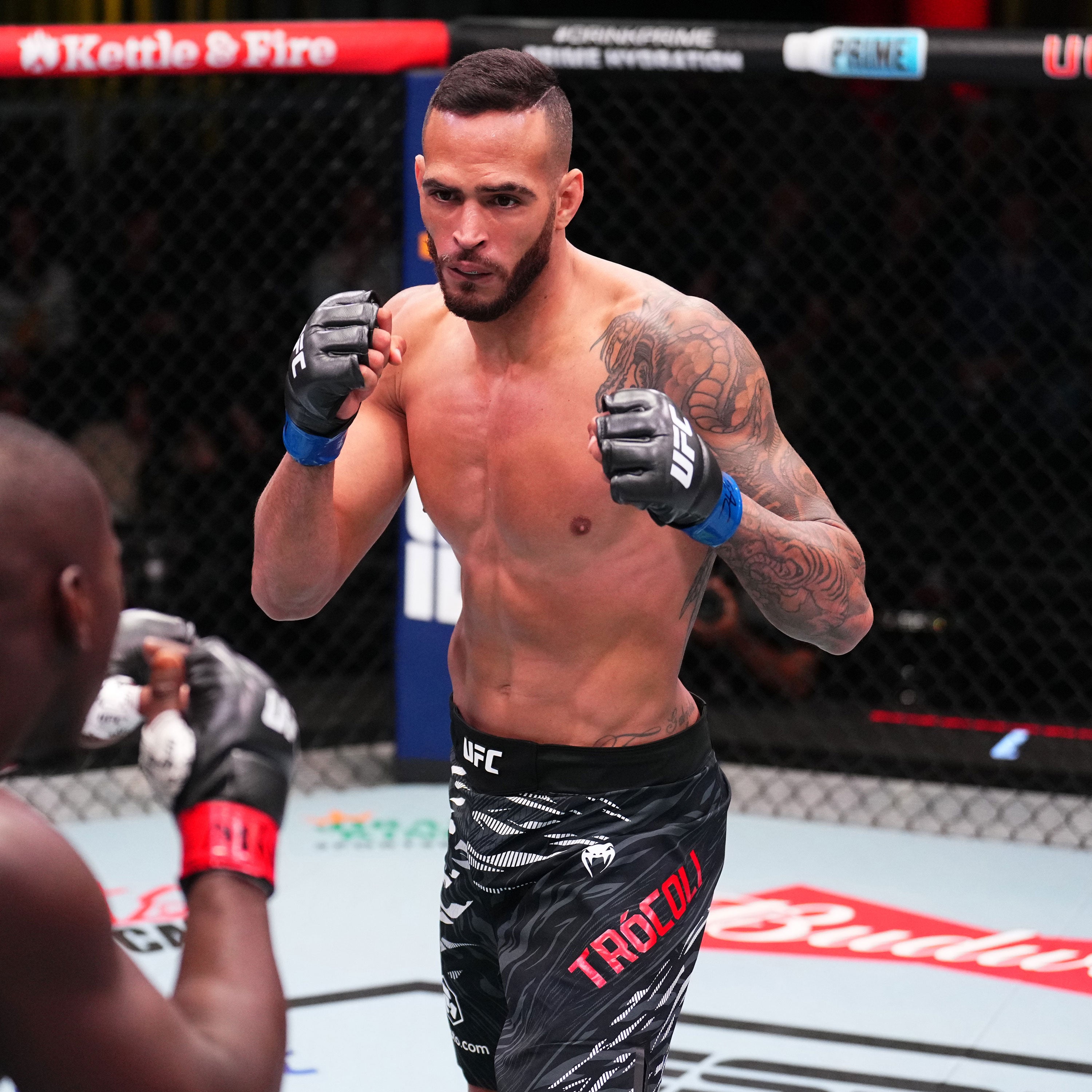 Ufc fighter with one boxing glove hotsell
